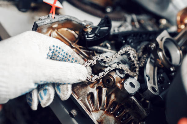 mechanic repairman at automobile car engine maintenance repair work. the chain of the engine. can use to display or montage product or make a website for service